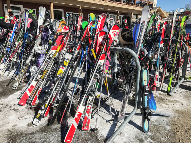 Stratton, VT, March 05, 2017: Skis and snowboards are resting on the racks near the main lodge at Stratton Mountain.