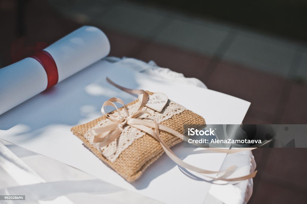 Curbstone for rings 1391. Table for wedding rings at wedding registration. Ceremony Stock Photo