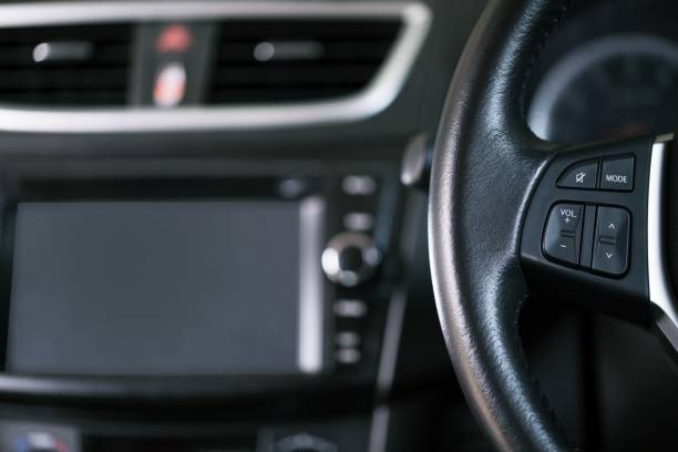 istock close up Modern black steering wheel with multifunction buttons Integrated stereo controls pushes the for quick control technology in the car. 952332208
