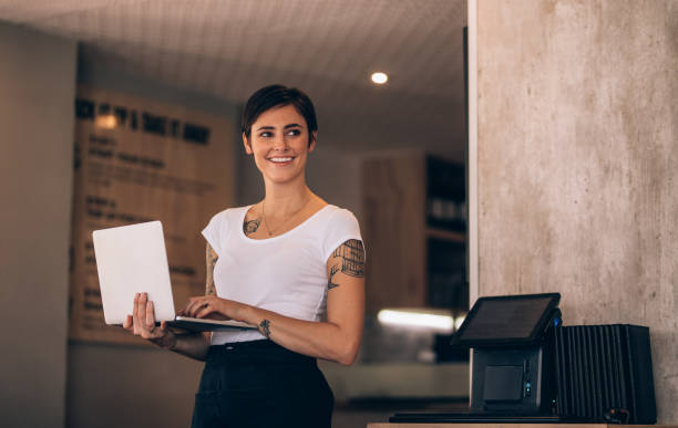 istock Woman with laptop in her restaurant 952339408