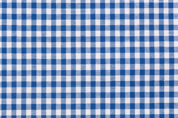 Blue and white checkered tablecloth Background of blue and white checkered tablecloth. gingham stock pictures, royalty-free photos & images