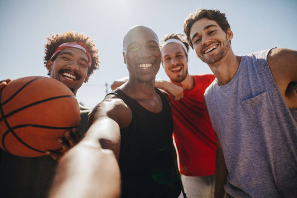 istock Men playing basketball posing for photo 952352336