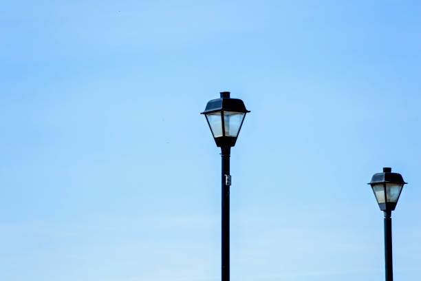 istock Street Lights Against Blue Sky 952357206
