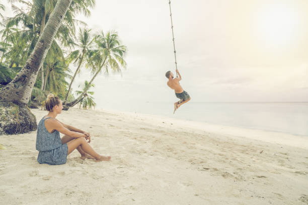 Young couple paying on beach, swing rope on palm tree Young couple paying on beach, swing rope on palm tree. People travel exotic concept
Shot in the Philippines on tropical Island vacations siquijor stock pictures, royalty-free photos & images