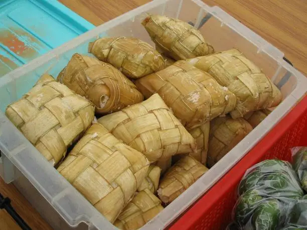 Photo of Puso or hanging rice, rice wrapped in coconut leaves Puso is rice wrapped in woven coconut leaves and boiled.