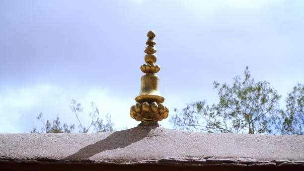 istock Brass statue on the roof with sky 952361692