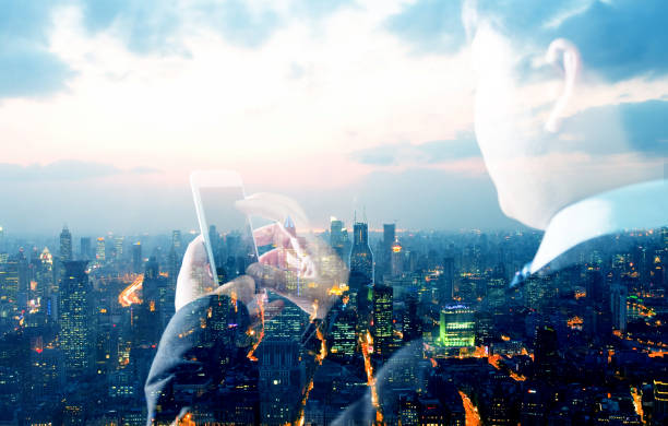 istock Multiple exposure of businessman hand using smart phone 952361990