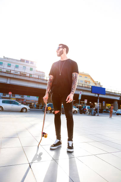 istock Young Men with his skateboard moving in the city 952362426