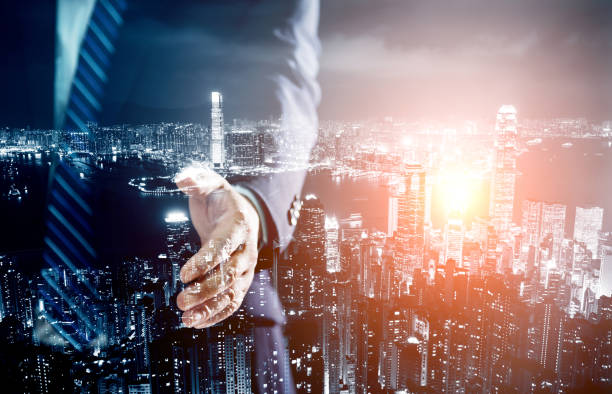 istock Multiple exposure of businessman handshake 952363512