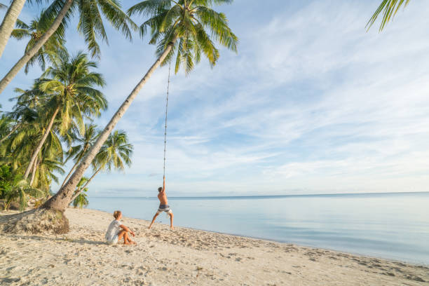 Couple playing on beach, swing rope on palm tree in tropical Island Asia Young couple playing on beach, swing rope on palm tree. People travel exotic concept
Shot in the Philippines on tropical Island vacations siquijor island stock pictures, royalty-free photos & images