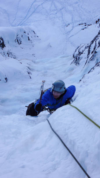 istock ice climbing in the Swiss Alps 952370200