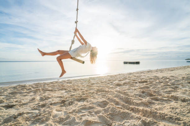 Woman playing on swing rope, tropical climate palm trees in the Philippines Islands Young woman playing on beach, swing rope on palm tree. People travel exotic concept
Shot in the Philippines on tropical Island vacations siquijor stock pictures, royalty-free photos & images