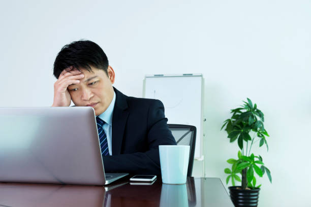 istock Businessman is thinking in office 952372608