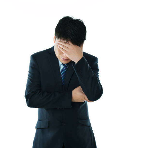 istock Businessman putting hand on forehead 952378628