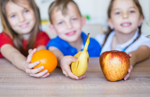 istock Beauty triplets love fruit 952379074