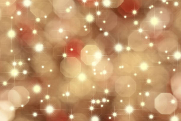 Abstract background consisting of various multibeam stars of different sizes and blurred octagonal shape bokeh. The general background - golden brown.