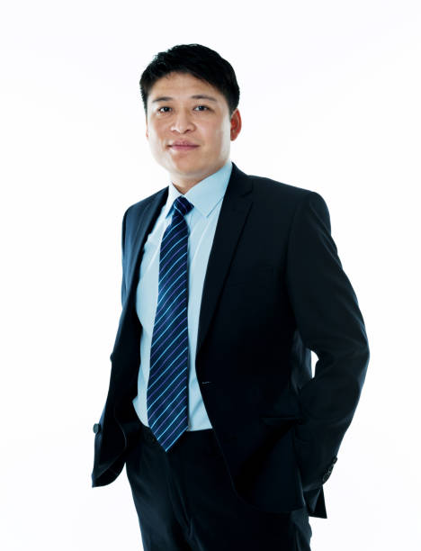 istock Businessman hands in pockets on white background 952387884