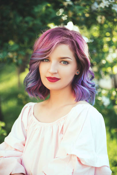istock Beautiful young woman in nature 952390562