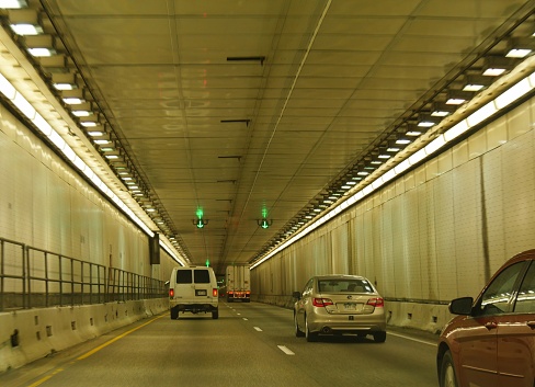 SUMMIT COUNTY, COLORADO—OCTOBER 2017: Cars drive through the Eisenhower Tunnel, also called the Eisenhower–Edwin C. Johnson Memorial Tunnel on Interstate 70 about 60 miles west of Denver.
