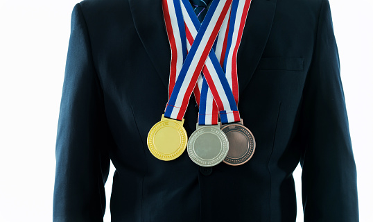 Medals hanging around a man neck.