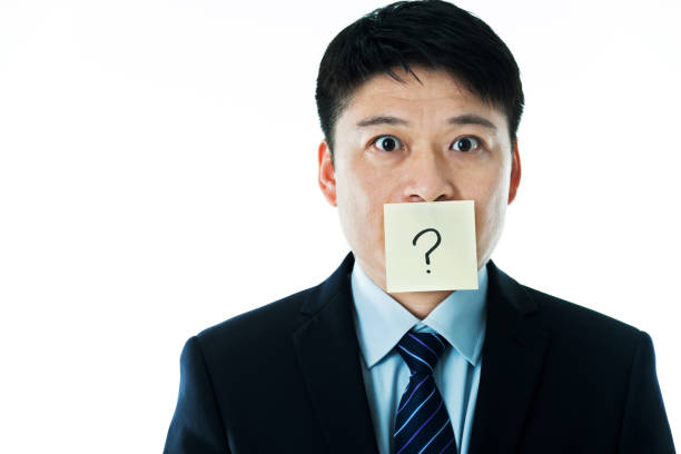 istock Businessman with question mark on the mouth 952393966