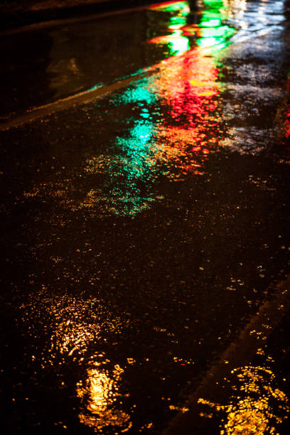 istock Water on street and color lighting 952394084