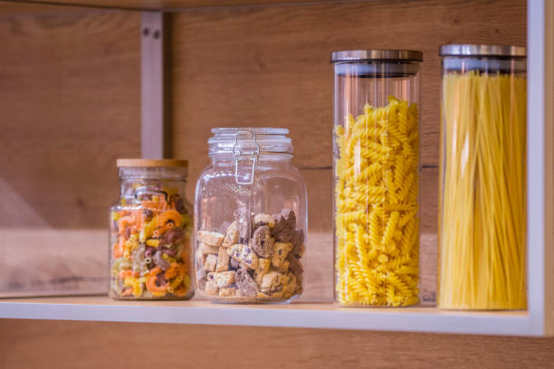 istock Close up of the kitchen objects - cookie jar, jars with pasta 952394568