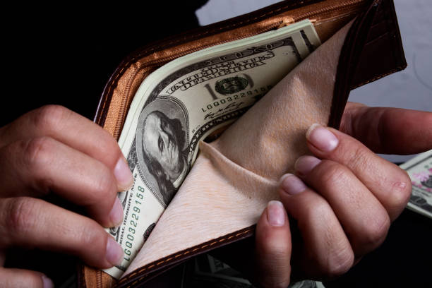istock Close-up of wallet with $100 bills inside 952394700