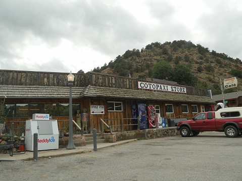 COTOPAXI,COLORADO—OCTOBER 2017: A wooden structure that houses a store, café and gasoline station serves as a stopover for motorists in Cotopaxi, Colorado.