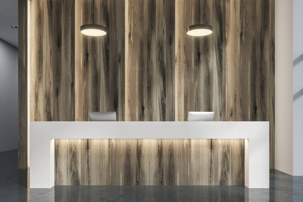 istock Wooden reception in a modern office close up 952397926