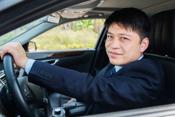istock Handsome businessman driving his car 952398472