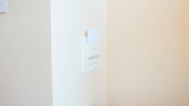 istock Closeup image key car holder on wall at hotel room 952398864