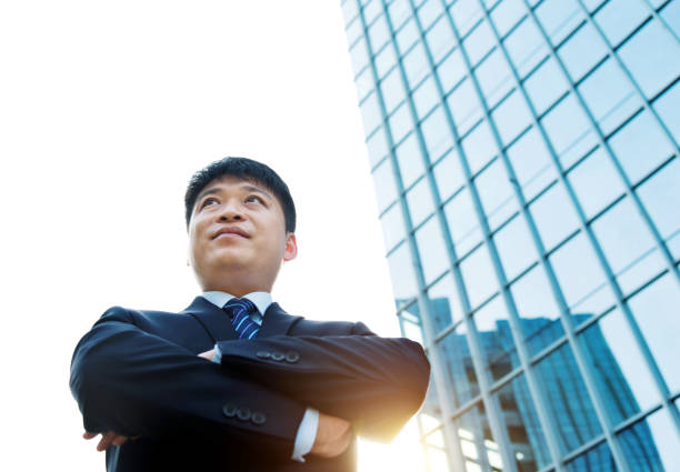 istock Businessman standing in front of office building 952402738