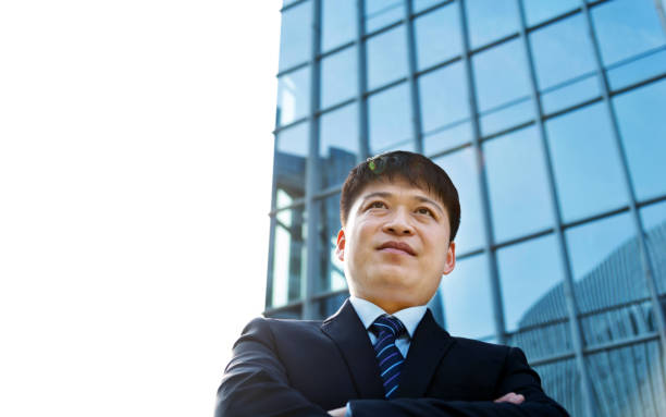 istock Businessman standing in front of office building 952402852