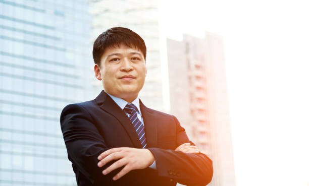 istock Businessman standing in front of office building 952402872