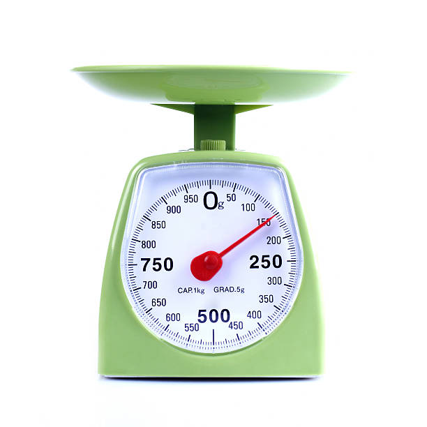 Set of green kitchen scales with red arrow pointing to 150 Green Scales Studio Shot Isolated On White libra photos stock pictures, royalty-free photos & images