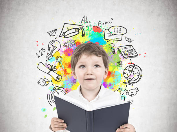istock Cute little boy with a book, school 952408090