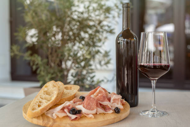 istock Prosciutto plate with a glass of red wine 952408292