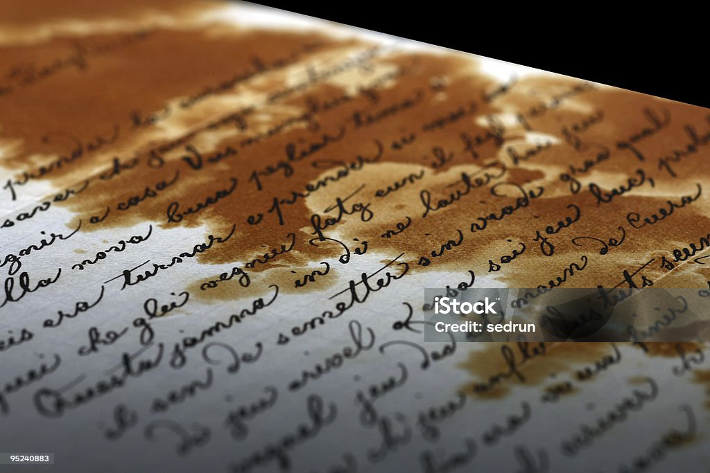 Old Letter on Black Background  Alphabet Stock Photo