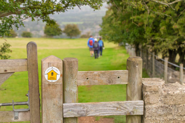Small sign directing the way to a group of ramblers, walking the Cotswold Way. stock photo