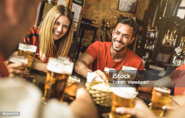 Happy Friends Group Drinking Beer At Brewery Bar Restaurant Friendship Concept With Young People Enjoying Time Together And Having Genuine Fun At Cool Vintage Pub Focus On Guy High Iso Image Stock Photo - Download Image Now