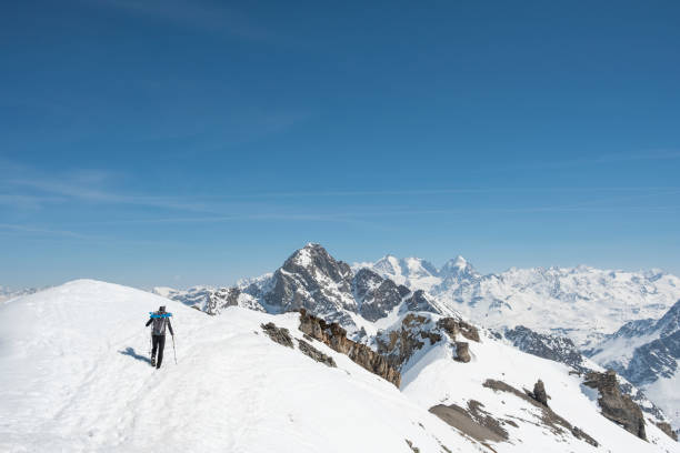 istock Hiker on snowy mountain summit 952416226