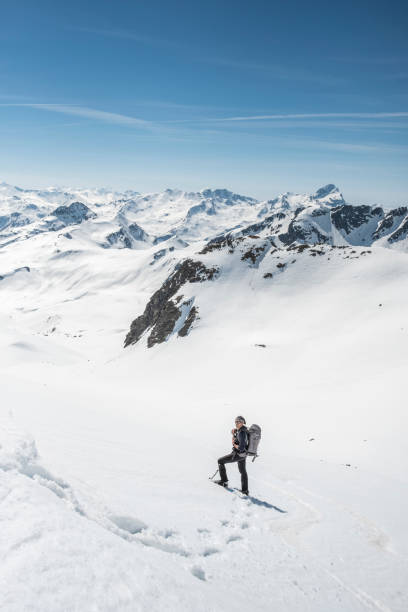istock Mountaineer on a snow capped majestic valley 952420952