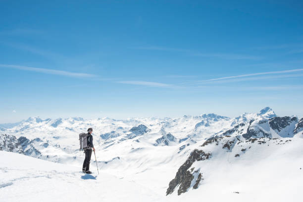 istock Mountaineer on a snow capped majestic valley 952420986