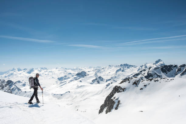 istock Mountaineer on a snow capped majestic valley 952420990