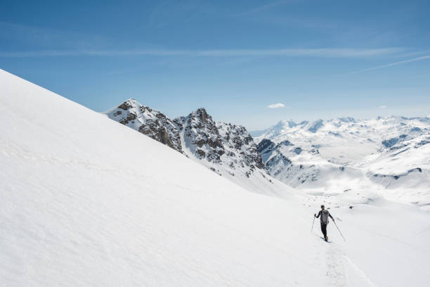 istock Mountaineer on a snow capped majestic valley 952421080
