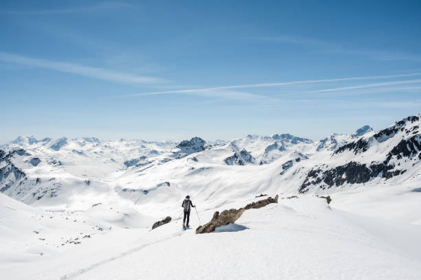 istock Mountaineer on a snow capped majestic valley 952421230