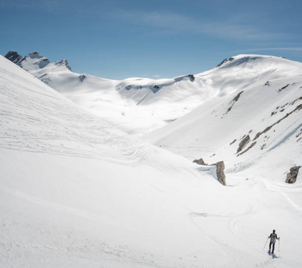 istock Mountaineer on a snow capped majestic valley 952421390