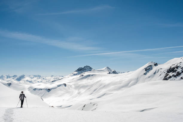 istock Hiker on snowy mountain summit 952421490