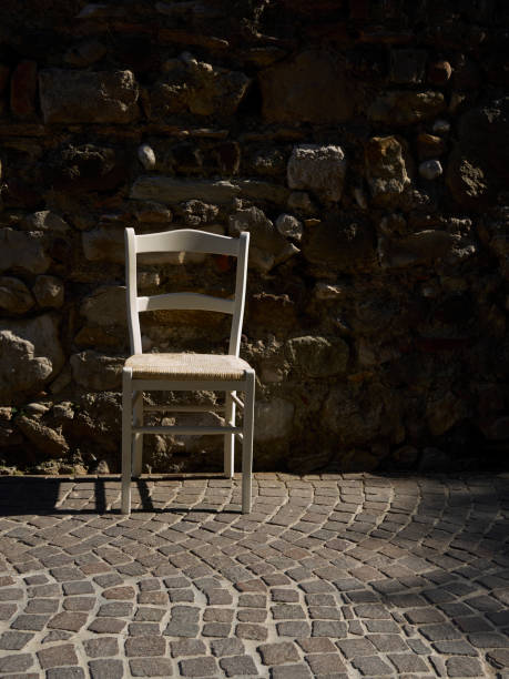 istock old white chair on the street 952426954